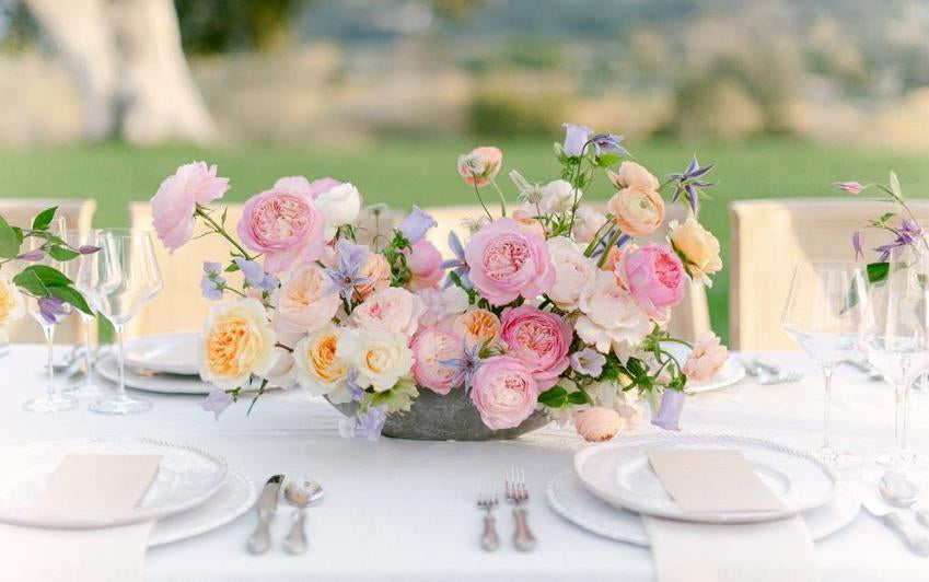 A display of David Austin wedding roses on a table