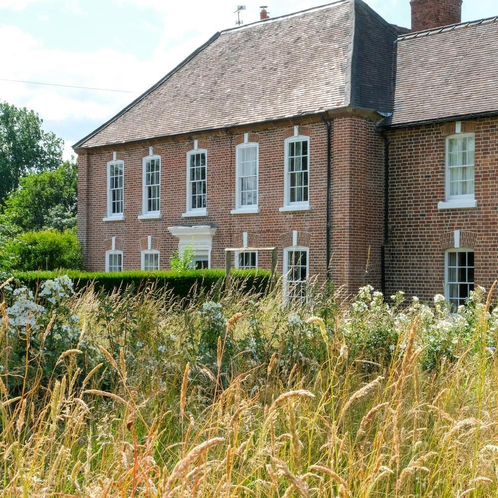 David Austin's house in Shropshire with Kew Garden's in a meadow.