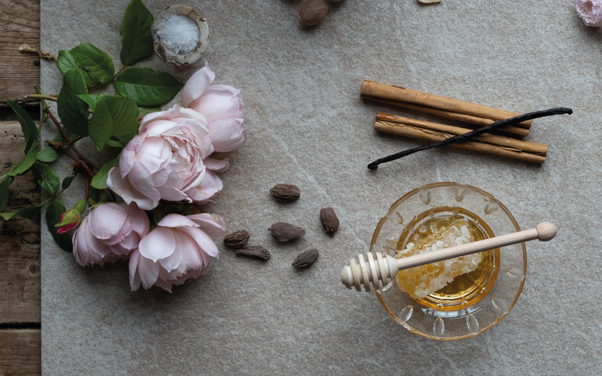 Flat lay image of a rose bred by David Austin, with visual fragrance notes