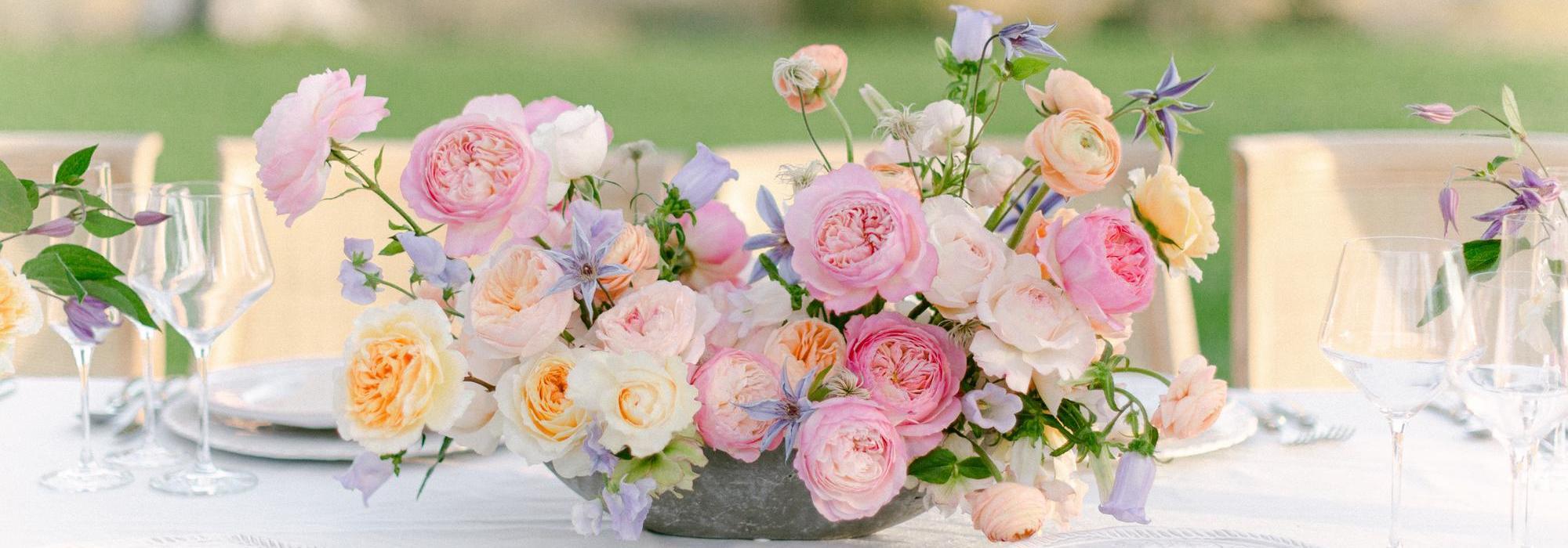 A display of David Austin wedding roses on a table