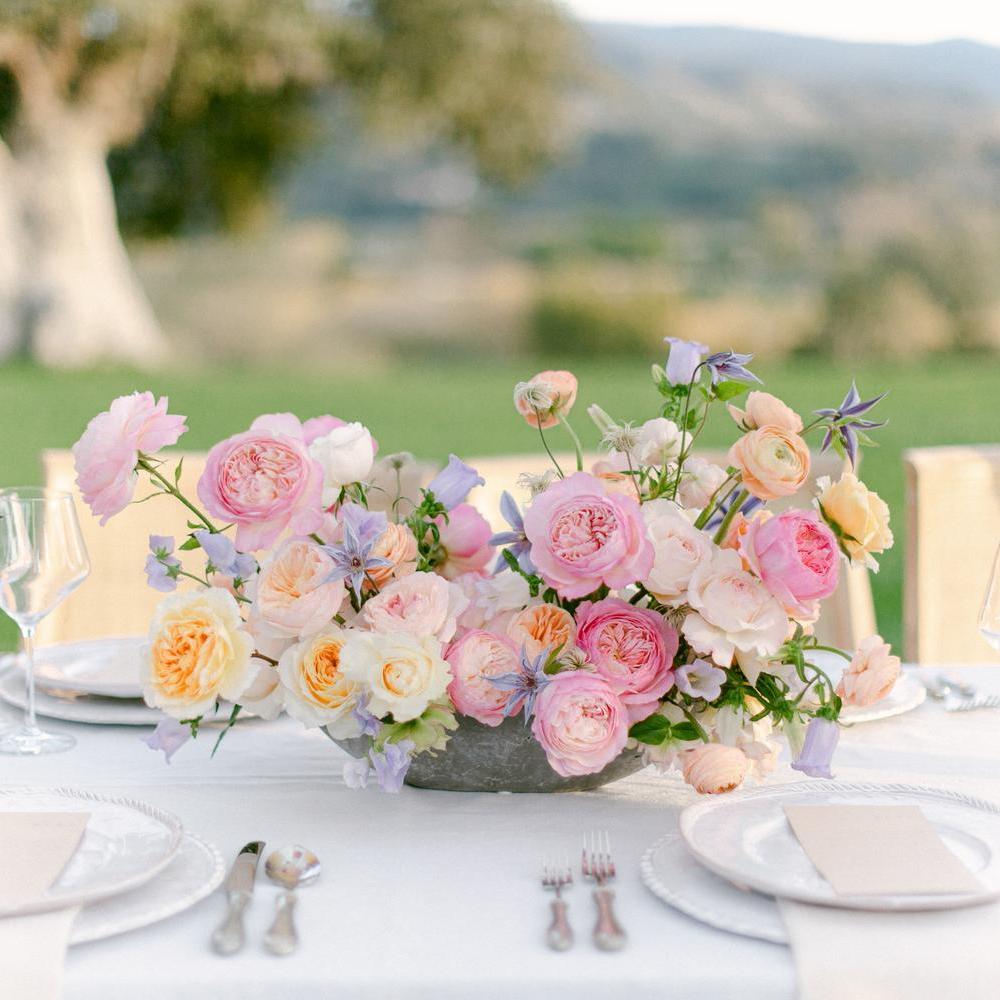 A display of David Austin wedding roses on a table