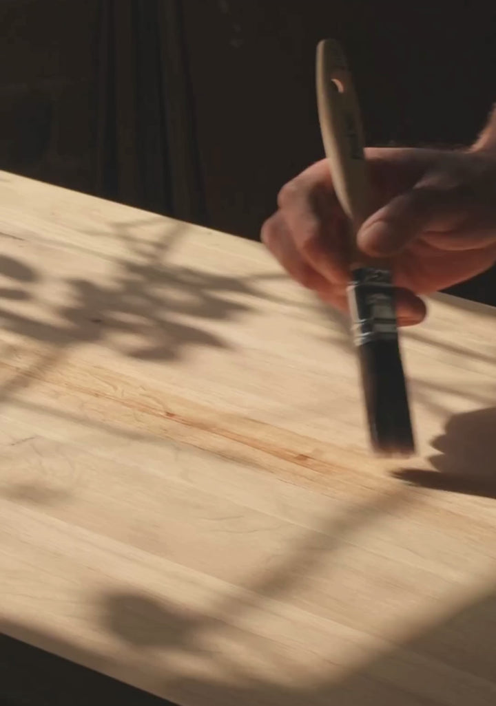 Person using a paint brush 