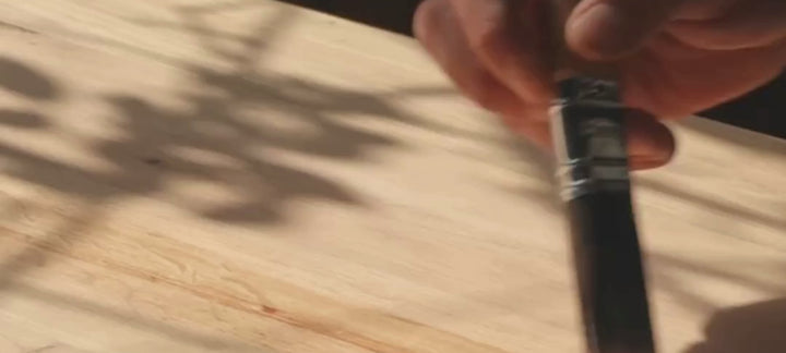Person using a paint brush 